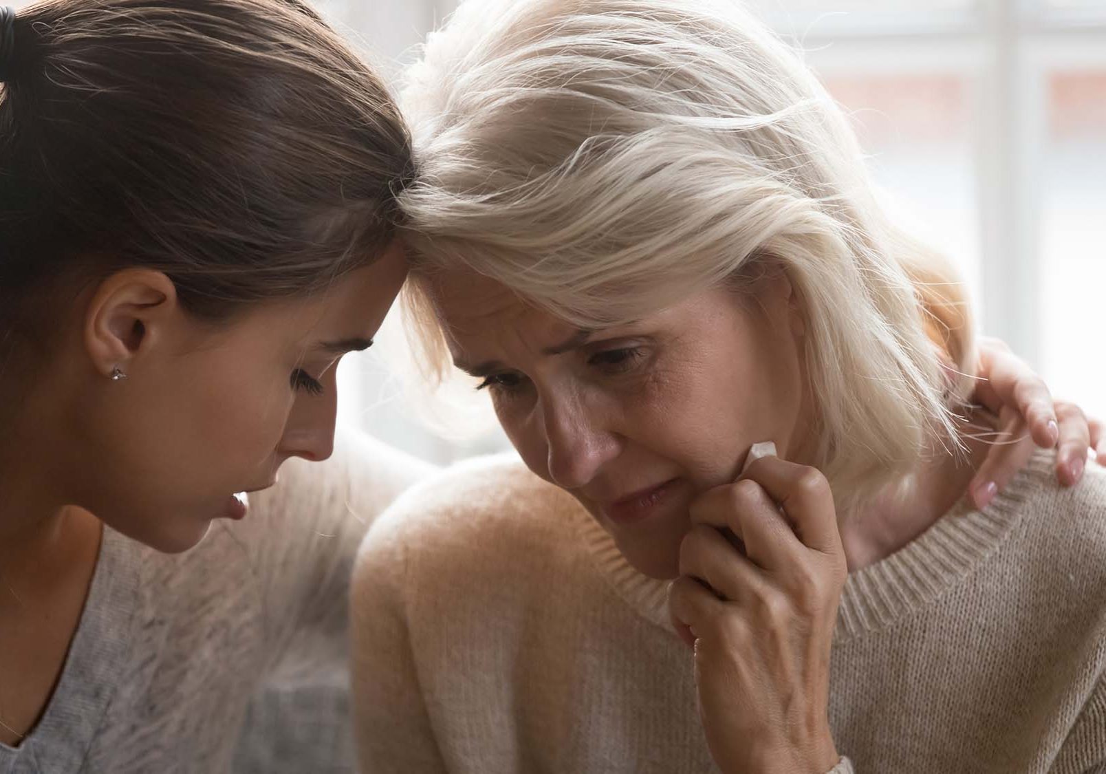 Young woman comforting a relative